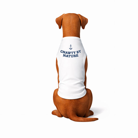 Dog wearing a white shirt with 'GNAWTY BY NATURE' text on a white background