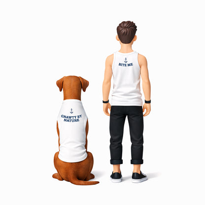 Figurine of a person and a dog wearing shirts with text on a white background